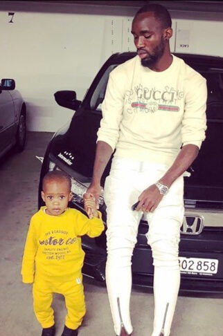Moumi Ngamaleu with his son.